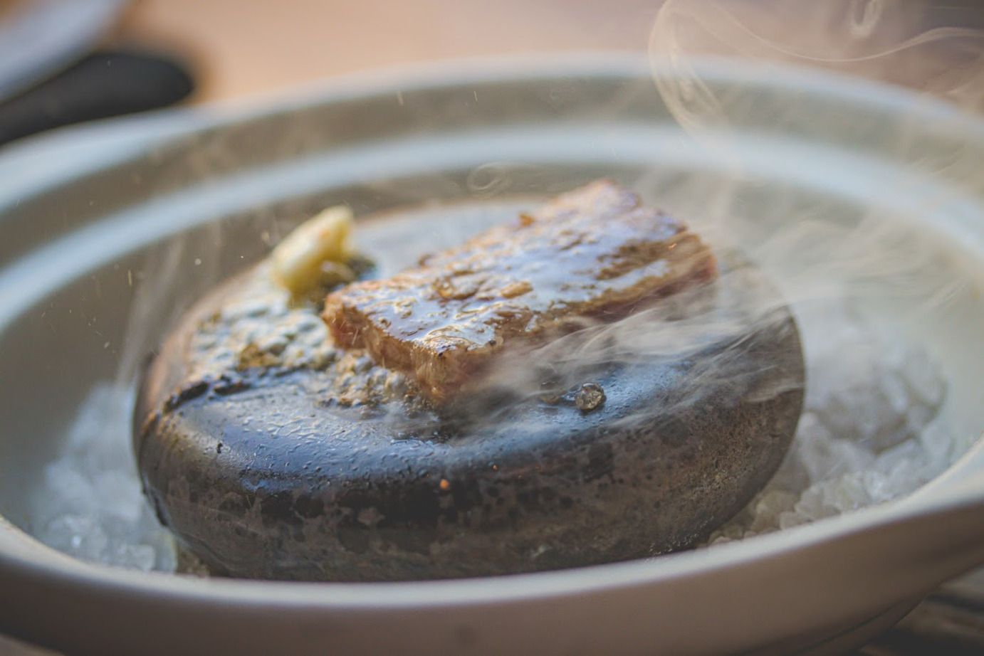 Frying a steak on a hot stone